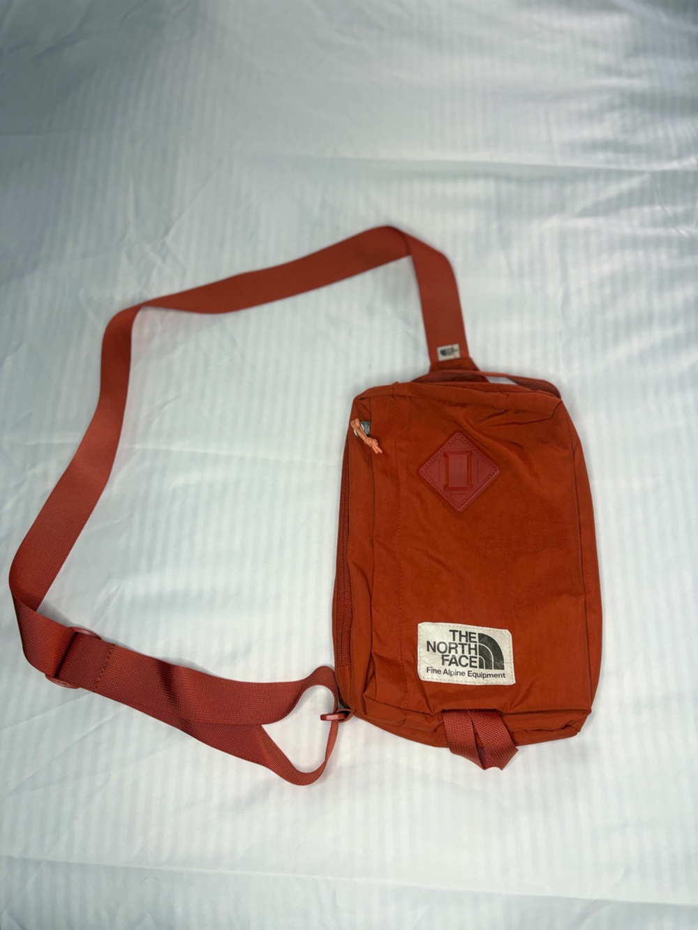 The North Face Rust Orange Sling Belt Bag
